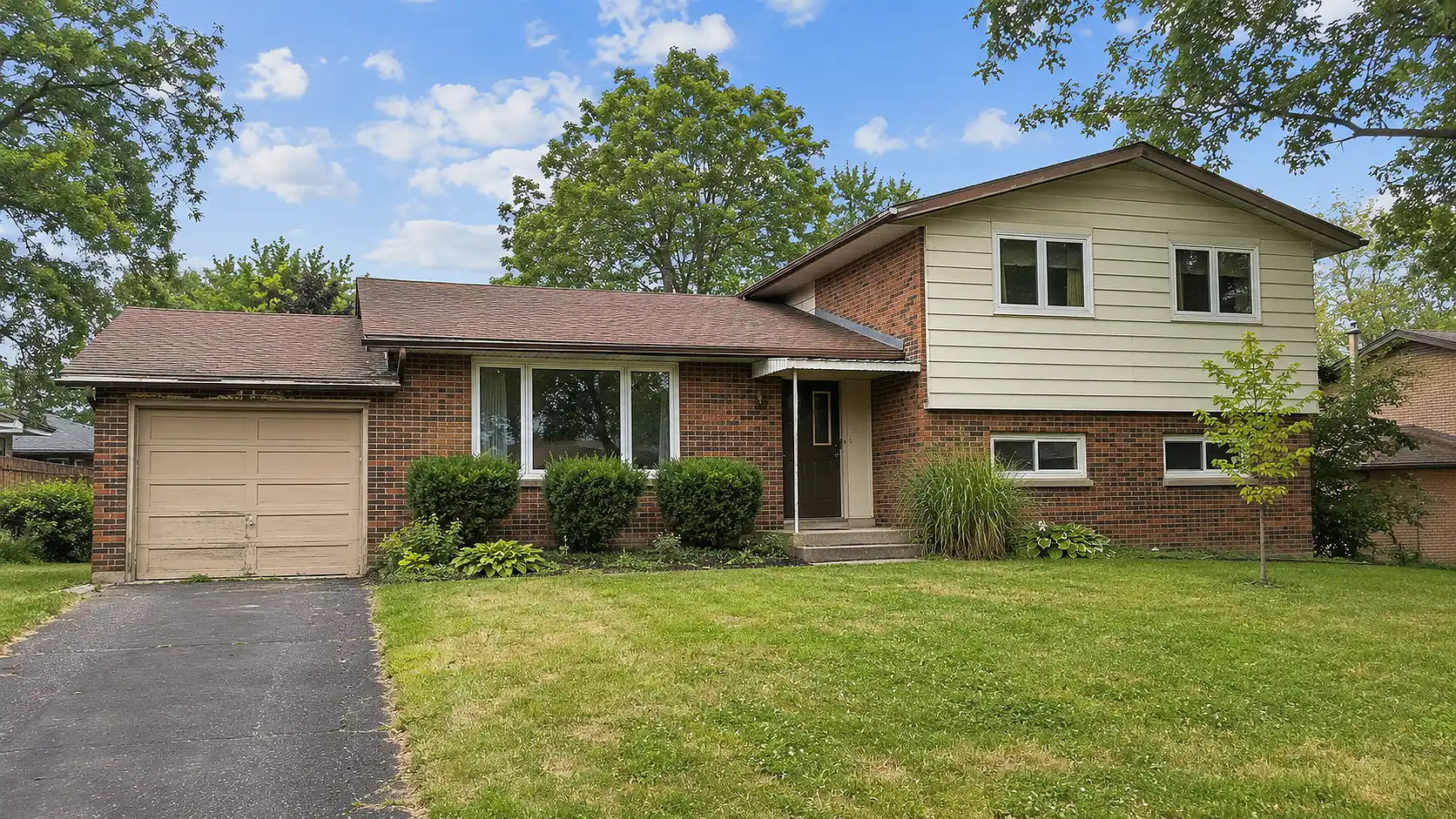 Brick And Siding House With Addition And Attached Garage